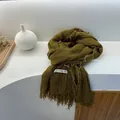 Detailed view of olive green frayed edge scarf with a 'WARM FOR YOU' woven label - 180cm x 90cm / Mustard Yellow