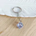 Creative translucent purple acrylic dice keychain featuring cute heart-shaped dots - Light Blue