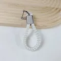Elegant white braided PU leather keychain featuring a silver-tone horseshoe buckle - White