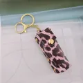 Elegant pink leopard print PU leather lipstick case keychain with gold-tone hardware - Pink