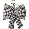 Détail d'un porte-clés en tissu à nœud papillon à carreaux noir et blanc avec fermoir argenté - Noir