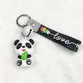 Close-up of cute cartoon panda keychain with PVC rubber pendant and love strap - Cartoon Strap (White Bell)