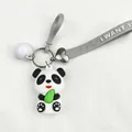 Detail shot of a cute cartoon PVC panda keychain with gray wrist strap and bell - Letter Strap (White Bell)