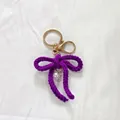 Porte-clés nœud en crochet violet fait main avec perle pour décoration de sac - Violet foncé