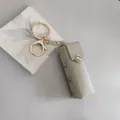 Mini étui à rouge à lèvres en cuir gris porte-clés avec bouton pression doré et rivets - Pochette pour Rouge à Lèvres / Gris