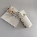 Étui à rouge à lèvres portable en cuir blanc avec bouton pression doré et miroir - Pochette pour Rouge à Lèvres / Blanc