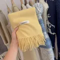 Soft light yellow knitted scarf with tassels and branded label for autumn and winter - Milk Yellow / 194cm