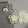 Minimalist grey flower shaped PU leather keychain with built-in portable makeup mirror - Gray-Silver Buckle