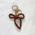 Cute handmade brown crochet bow keychain with pearl charm for bags and keys - Brown