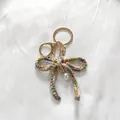 Handmade multi-color crochet bow keychain with elegant faux pearl charm for bags - Gradient Pink Green