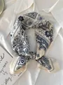 Close-up of elegant paisley pattern silk scarf tied on a white shirt - 70cm / White Paisley