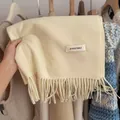 Cozy cream knit scarf with stylish tassel detail and minimalist brand label - 194cm / Korean Light Yellow