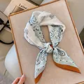 Elegant light blue and white paisley silk scarf variant with refined orange border - Twin Paisley - Mint Green