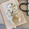 Elegant cream and yellow paisley print silk scarf for head, neck, or handbag styling - Twin Paisley - Champagne