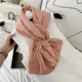 Elegant pleated pink scarf styled on a white dress with luxury fashion accessories - Rose Tea