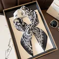 Elegant black and white paisley silk square scarf shown in a stylish knotted display. - 70x70cm / Polka Dot Paisley