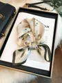 Elegant silk square scarf featuring delicate white floral patterns and green borders - Floral Square Scarf / Cream White (Camellia Print)