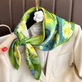Elegant green silk square scarf with vibrant yellow flower print for stylish outfits - Lotus Print Scarf / Lotus Green Print