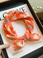 Stylish orange cotton small square scarf featuring white and blue abstract floral print - Orange Plumeria