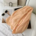 Elegant peach pleated cotton blend long scarf with a soft texture for versatile styling - Peach