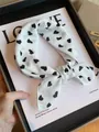 Monochrome white small square cotton scarf with black heart print tied in a knot - White Heart