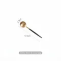 Matte black and gold stainless steel dessert spoon, 12.3cm length - Black & Gold