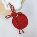 Handcrafted red woven bamboo fan pendant with a traditional Chinese knot decorative design - Red Fan With Chinese Knot / Red