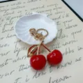 Cute realistic red cherry keychain with gold-plated stem and leaf for women bag charm - Red