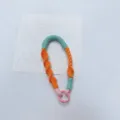 Handmade colorful woven phone strap with pink metal O-ring for keys and headphone cases - Orange + Green