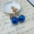 Cute blue cherry keychain with gold metal leaf accessory for bag decoration and gift - Blue