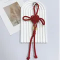 Red handmade woven Chinese knot keychain and bag charm with a golden coin ornament - Red