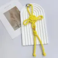 Handmade yellow braided Chinese knot bag charm with gold coin detail - Yellow