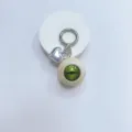 Gothic eyeball keychain with realistic green iris and silver metallic heart charm accessory. - Cream Ball Green Eye