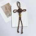 Handmade brown braided cord keychain with gold coin charm and cross knot design. - Brown