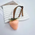 Cute peach pink realistic strawberry bag charm featuring a brown leather hanging strap - Pink Strawberry No Spots