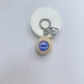 Realistic blue gothic eyeball keychain featuring a shiny silver heart bag charm accessory - Cream Ball Purple Eye