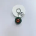 Gothic horror eyeball keychain with silver heart charm and demon eye bag accessory. - Green Ball Brown Eye
