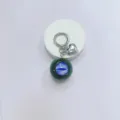 Gothic demon eye keychain featuring blue eyeball orb and silver heart charm bag accessory - Green Ball Purple Eye