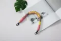 Hand-woven colorful paracord wrist strap for phone or bag charm decoration - Fish Mouth Clasp with Tether Pad / Pink, Yellow & Gray