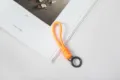 Handmade vibrant orange braided paracord keychain with a black spring ring loop - Orange Rope + Gun Black Spring Ring