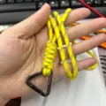 Handmade bright yellow paracord lanyard with a black triangular carabiner for outdoors. - Triangle Spring Ring Style / Camo Yellow