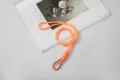 Vibrant orange hand-woven paracord phone lanyard with a matching metal carabiner hook - Orange Cord With Orange Clip And PVC Pad / Orange
