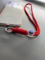 Adjustable red braided phone wrist lanyard with blue buckle detail and hook - Red Rope + Pink Spring Ring