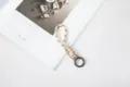 Beige handcrafted braided rope keychain featuring black patterns and metal spring ring - White Rope + Gun Black Spring Ring