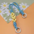 Handmade woven daisy wrist strap lanyard in blue and yellow paracord with white ring - Spring Ring and Patch Style / Blue + Yellow