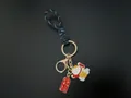 Hand-woven cord keychain featuring a cute lucky cat and auspicious blessing charms - Lucky Cat (Good Luck) / Black