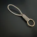 Hand-woven khaki paracord keychain with a durable golden metal ring for car keys - Gray