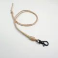 Minimalist beige braided wax rope lanyard featuring a durable black metal lobster clasp - Apricot