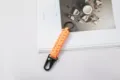 Hand-woven bright orange seven-core paracord keychain with black eagle beak carabiner clip - Orange