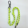 Neon yellow braided rope bag charm featuring a silver carabiner and decorative knots - Fluorescent Green